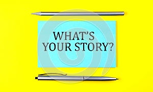 Text WHAT`S YOUR STORY on the blue sticker on the yellow background