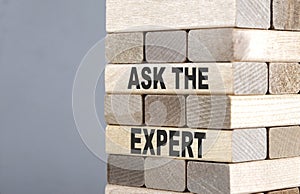 The text on the wooden blocks ASK THE EXPERT
