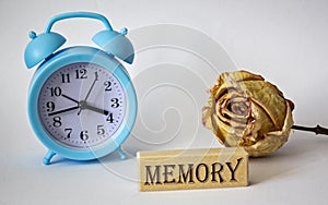 Text on wooden blocks. Memory. On a white background an alarm clock