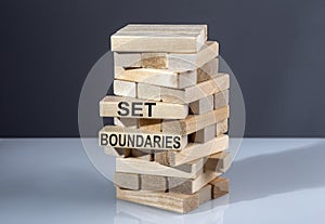 The text on the wooden blocks SET BOUNDARIES photo