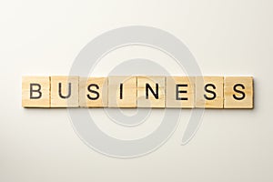 Text wooden blocks spelling the word BUSINESS on white background