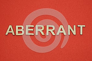 Text the word aberrant from gray wooden small letters photo