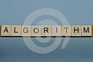 Text the word algorithm from brown wooden small letters