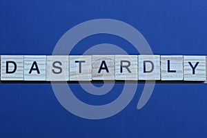 text the word dastardly from brown wooden small letters