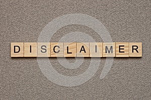 Text the word disclaimer from brown wooden small letters