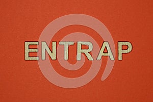 Text the word entrap from gray wooden small letters