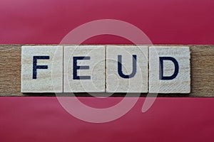 Text the word feud from gray wooden small letters