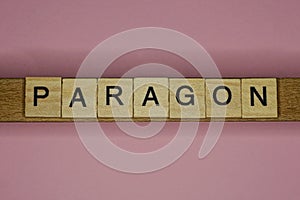 Text the word paragon from gray wooden small letters