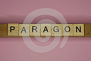 Text the word paragon from gray wooden small letters photo