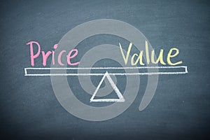 Text word price and value balance on seesaw drawing writing on chalkboard or blackboard background. Concept of price and value