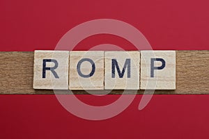 text the word romp from gray wooden small letters photo
