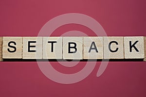 Text the word setback from gray wooden small letters