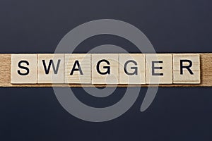 Text on word swagger from gray wooden letters photo