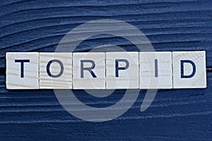 text the word torpid from brown wooden small letters