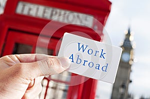 Text work abroad in a signboard with the Big Ben in the backgrou photo