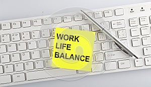Text WORK LIFE BALANCE on the keyboard on the white background