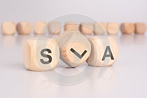 text 'SLA' - Service Level Agreement - on wooden cubes photo