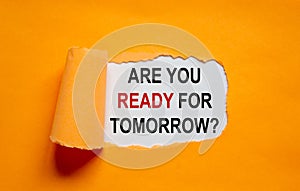 The text `are you ready for tomorrow` appearing behind torn orange paper. Business concept. Copy space