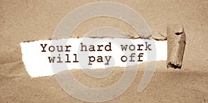 The text Your hard work will pay off appearing behind torn brown paper. Business startup development or career concept