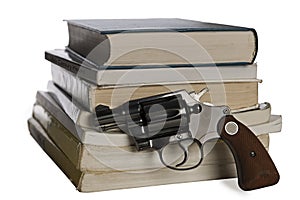 Textbooks and pistol photo