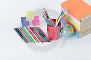 Textbooks and school supplies on white background .photo with copy space