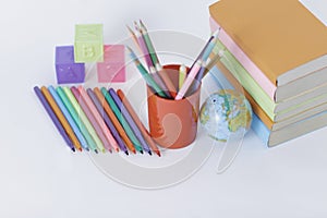 Textbooks and school supplies on white background .photo with copy space