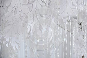 Textile background closeup. White drapery fabric flowers. Wedding texture, lace