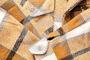Textile background from cotton material. Checkered shirt