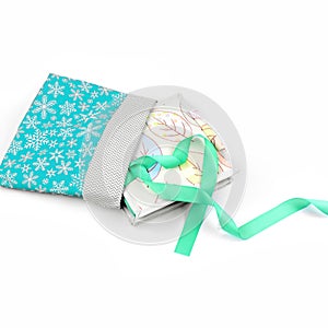 Textile book with a blue ribbon in a gift bag