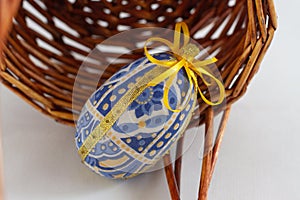 Textile Easter eggs with a wicker basket