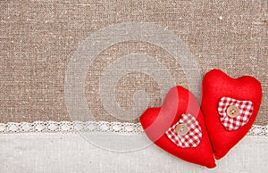 Textile hearts and linen cloth on the burlap