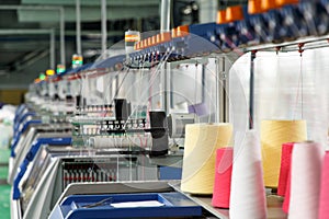 Textile industry with knitting machines photo