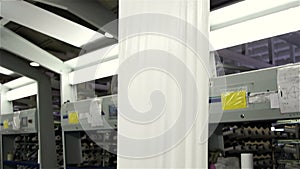 Textile industry - yarn spools on spinning machine