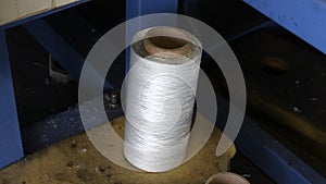 Textile industry - yarn spools on spinning machine