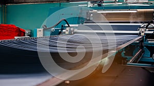 Textile Manufacturing. Circular knitted fabric. Textile factory in spinning production line and a rotating machinery and equipment