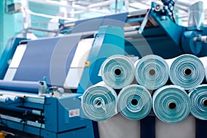 Textile Manufacturing. Circular knitted fabric. Textile factory in spinning production line and a rotating machinery and equipment photo