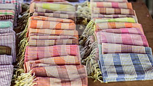 Textile Native, Colorful scarf and fabric souvenir silk weaving at small village Crafts. Siem Reap, Cambodia