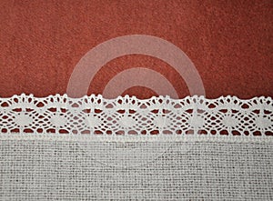 Textile red brown and ivory white lace horizontal background with light gradient