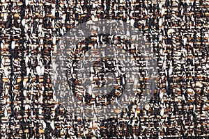 Interlacing of threads in motley boucle fabric photo
