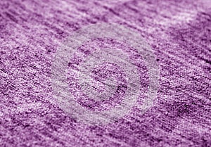 Textile texture with blur effect in purple tone
