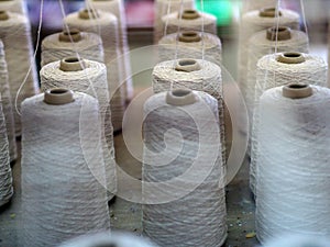 Textile threads industry spoon close up