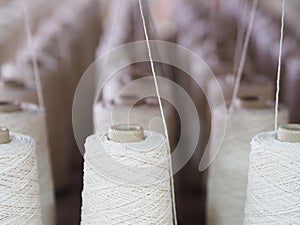 Textile threads industry spoon close up