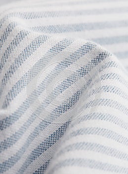 Textile - white and blue shirt fibers close-up, macro photography with volumes