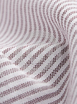 Textile - white and red stripes - shirt fibers close-up, macro photography with volumes