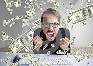 texting money. very happy man shouting in front of the computer, money everywhere photo