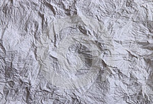 Textural of crumpled tissue paper in white and grey tone.