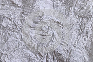 Textural of crumpled tissue paper in white and grey tone.