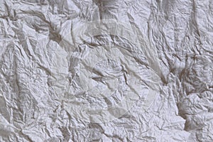 Textural of crumpled tissue paper in white and grey tone.