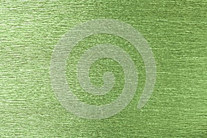 Textural of green background of wavy corrugated paper, closeup