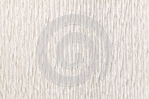Textural white background of wavy corrugated paper, close-up.